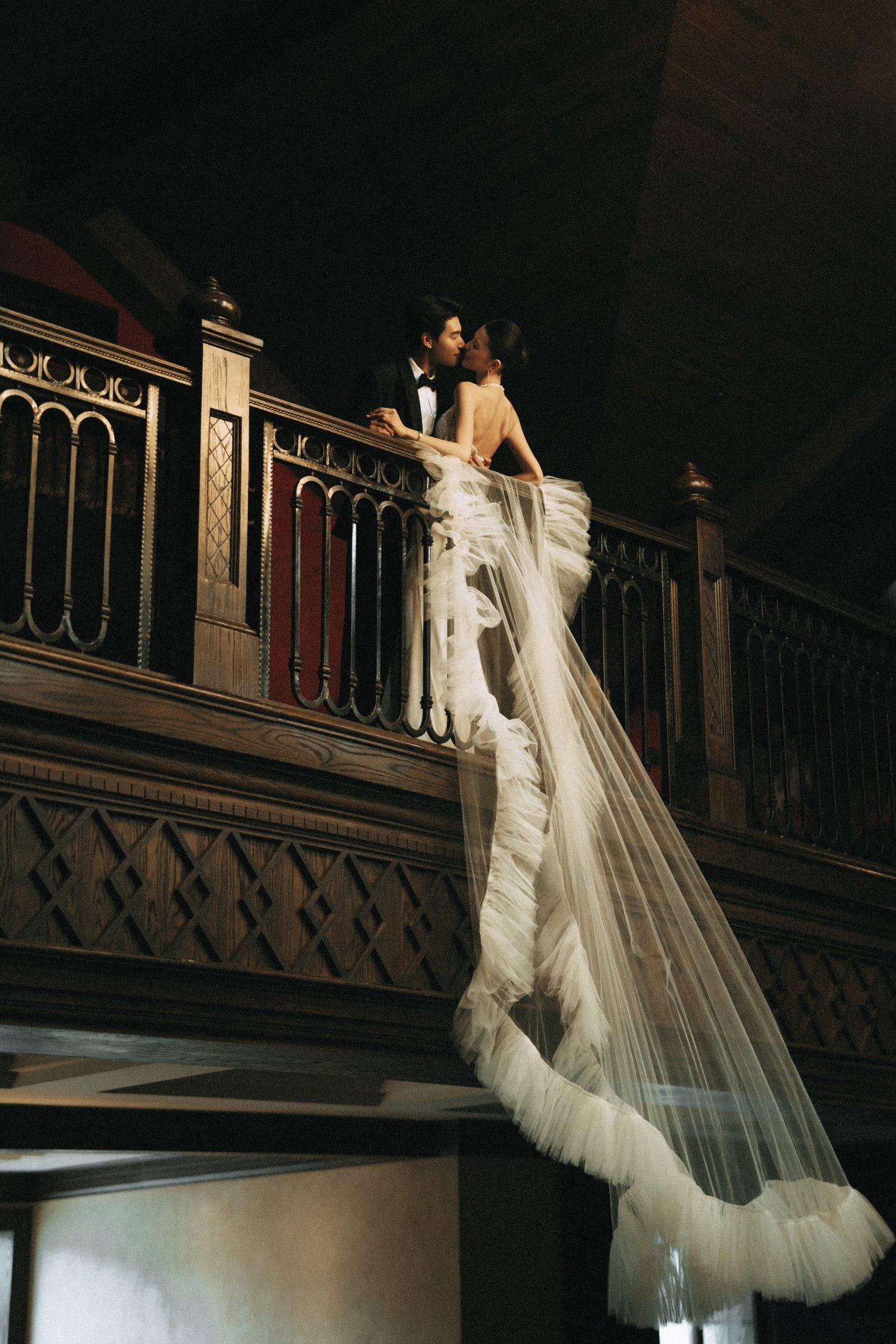 Newlyweds sharing a quiet moment on a cinematic staircase